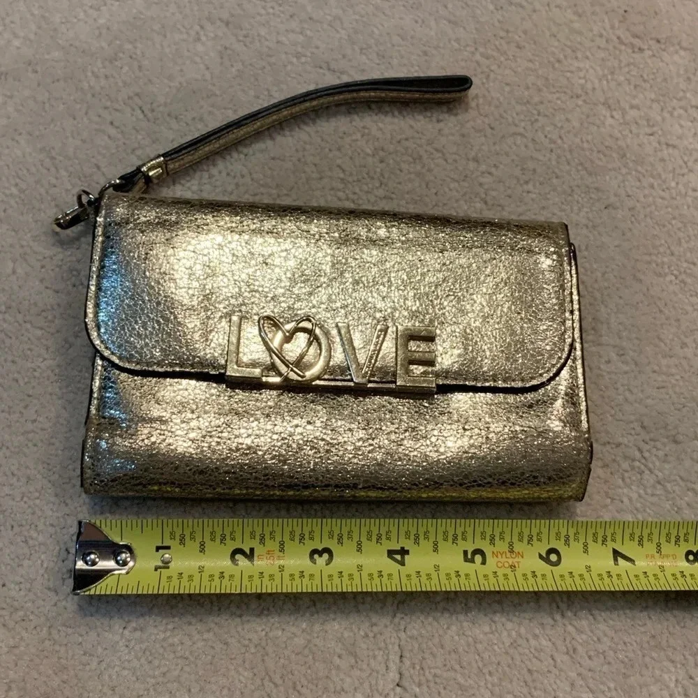 VICTORIA’S Secret shimmer phone wallet, golden